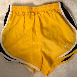 Yellow Nike tempo running shorts